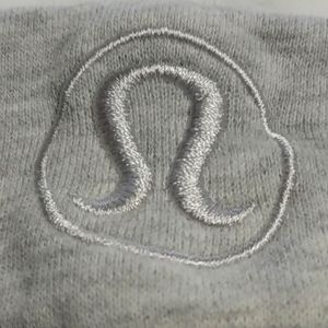 This is a Lululemon jacket with hood and thumb holes/ color grey like new.